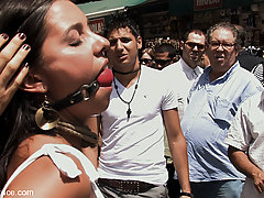 Humiliation Pictures -  Beautiful brunette is blindfolded and lead fully naked through the center of town