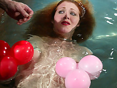 Water Bondage Pictures -  Statuesque redhead is bound and water tortured