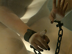Water Bondage Pictures -  Introducing the Cylinder of Fear! Maya is shackled down